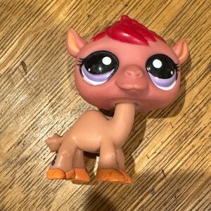 Cute Brown Toy Figure with Red Hair